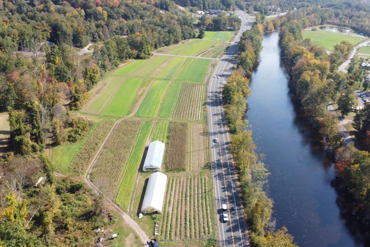 Aerial of farm next to the river