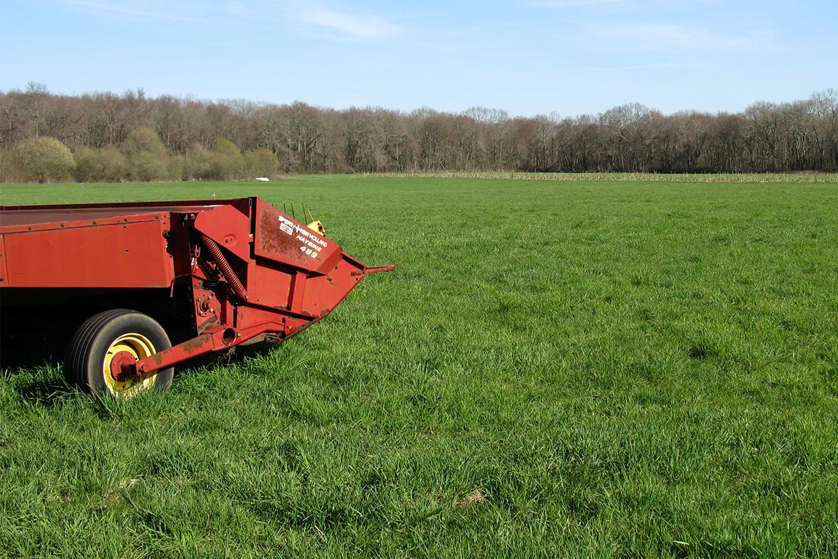 red farm equipment in the field